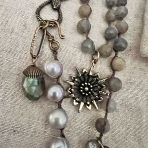 Hand made necklace with natural beading and gems.